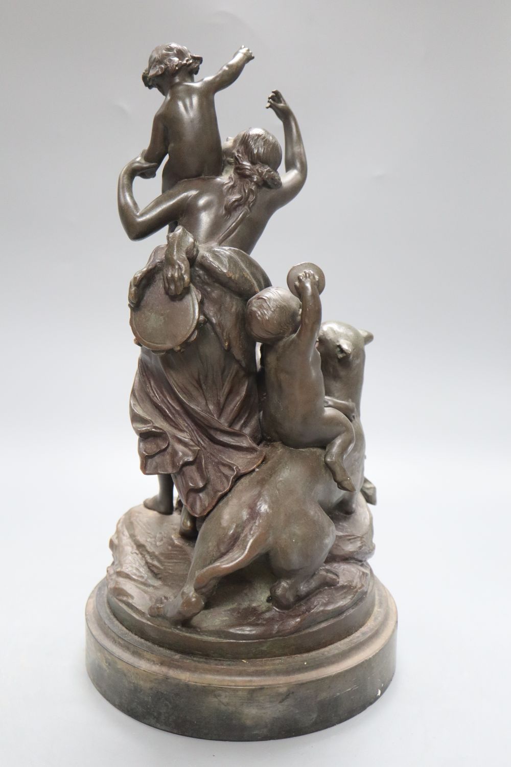 After Clodion. A bronze group of a mother, three putti and a panther, on naturalistic base and slate plinth, height 37.5cm